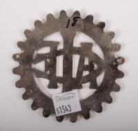 FRANCE:&nbsp;A nickel plated 'AUTOMOBILE-CLUB DE L'ILE DE FRANCE' membership badge, cog design&nbsp;with 'ACFI' emblem to centre, side mounts; 8.5cm in diameter. - 2