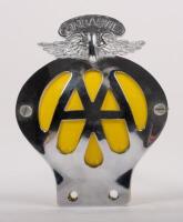 ZIMBABWE: A Zimbabwe Automobile Association badge with winged finial, yellow backplate, mounting brackets, 12.5cm high, 9.5cm wide