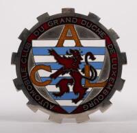 LUXEMBOURG: An Automobile Club of Luxembourg badge, cog design, enamel shield to centre, 8cm in diameter