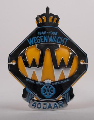 NETHERLANDS: A Dutch Tourist Association 40 year anniversary badge with crown finial, yellow backplate, mounting holes, 13.5cm high, 10.5cm wide