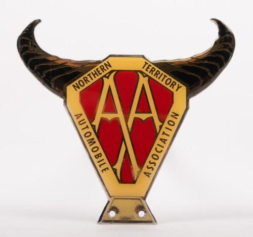 NORTHERN TERRITORY: A Northern Territory Automobile Association badge with horn finial, mounting holes, 12cm high, 12cm wide