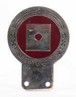 THE PISTON RING: A chrome enamel&nbsp;'The Piston Ring' badge, with mounting holes, 7cm in diameter