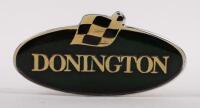 DONINGTON: A Donington oval badge, 7.5cm wide