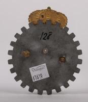 GREECE: An early Greek badge, cog design, Greek lettering, crown finial, with mounting pins, 10cm high, 8.5cm wide - 2
