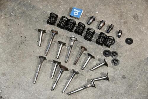 VALVES: A group of valves, valve springs and keepers. [Location: Sydney]
