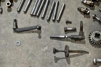 AUSTIN: A group of miscellaneous Austin Seven parts including&nbsp;idler gears, valves and steering link. [Location: Sydney] - 4