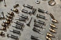 AUSTIN: A group of miscellaneous Austin Seven parts including&nbsp;idler gears, valves and steering link. [Location: Sydney] - 5