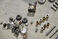 AUSTIN: A group of miscellaneous Austin Seven parts including&nbsp;idler gears, valves and steering link. [Location: Sydney] - 7