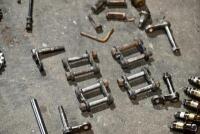 AUSTIN: A group of miscellaneous Austin Seven parts including&nbsp;idler gears, valves and steering link. [Location: Sydney] - 14