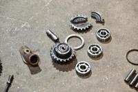 AUSTIN: A group of miscellaneous Austin Seven parts including&nbsp;idler gears, valves and steering link. [Location: Sydney] - 15
