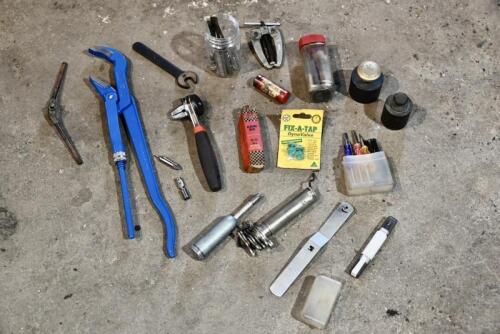 TOOLS: Miscellaneous group of tools including screw driver, grease gun and wheel puller. [Location: Sydney]