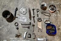 MISCELLANEOUS: A quantity of miscellaneous parts including clamps, headlight mounts, pillion rests, foot rubbers. [Location: Sydney]