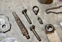 MISCELLANEOUS: A quantity of miscellaneous parts including clamps, headlight mounts, pillion rests, foot rubbers. [Location: Sydney] - 3