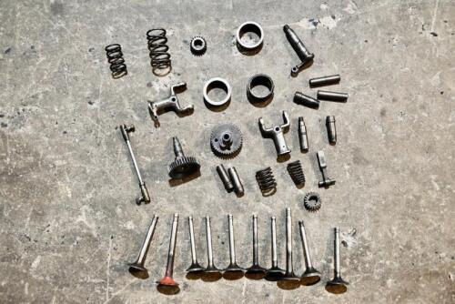NORTON: A quantity of engine parts believed to be Norton including springs, cams, valves, pinion gears, rocker posts. [Location: Sydney