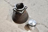 AJS: A cylinder head for a 350cc AJS complete with new piston and rings [Location: Sydney]