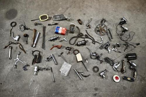 BICYCLE: Various miscellaneous bicycle parts including chains and brake levers. [Location: Sydney]