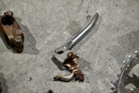 BICYCLE: Various miscellaneous bicycle parts including chains and brake levers. [Location: Sydney] - 4