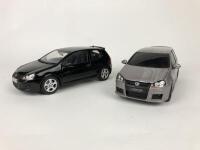 VOLKSWAGEN: Pair of 1:18 scale VW Golfs produced by Norev (NB description)