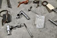 BICYCLE: Various miscellaneous bicycle parts including chains and brake levers. [Location: Sydney] - 11