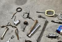 BICYCLE: Various miscellaneous bicycle parts including chains and brake levers. [Location: Sydney] - 12