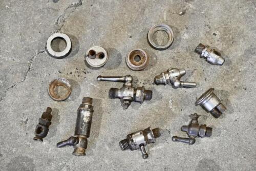 FUEL TAPS: A quantity of fuel taps and carburettor tops, unknown make or models. [Location: Sydney]
