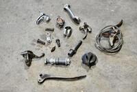 HANDLEBARS: A group of miscellaneous handlebar parts including&nbsp;levers, controls and horn button. [Location: Sydney]