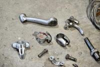 HANDLEBARS: A group of miscellaneous handlebar parts including&nbsp;levers, controls and horn button. [Location: Sydney] - 5