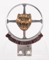 JAGUAR: A British Jaguar Drivers' Club members badge, steering wheel design, Jaguar head to centre, made by Pinches of London, numbered 'B136' at reverse, 11cm high, 8cm wide