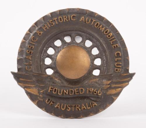 C.H.A.C.A: A Classic & Historic Automobile Club of Australia badge, wheel design, wings to bottom, approx 10cm in diameter