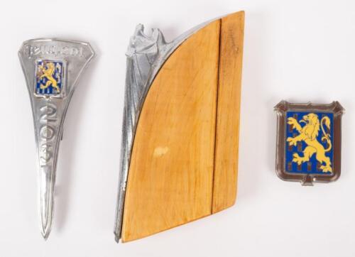 PEUGEOT: A group of three Peugeot related mascots and badges
