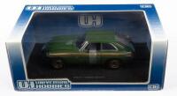 MGB GT: A&nbsp;1:18&nbsp;scale&nbsp;MGB GT model, this Jubilee edition is finished in green with gold stripes