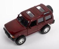 LAND ROVER: A 1:32 scale 1997 Land Rover Discovery model, colour burgundy, by Speedy Power Models, no box
