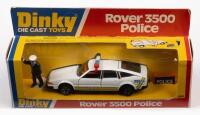 ROVER: A DINKY TOYS, 1979 Rover 3500 police car with Figurine and police sign set (#264), in box