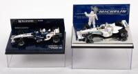WILLIAMS F1 TEAM: A pair of 1:43 scale Williams F1 models, a Williams BMW FW27 driven by Webber, also a Williams F1 BMW FW21B with a Michelin figurine