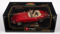 &nbsp;JAGUAR E TYPE:&nbsp;A 1:18&nbsp;scale&nbsp;1961 Jaguar E type cabriolet model, finished in red paintwork