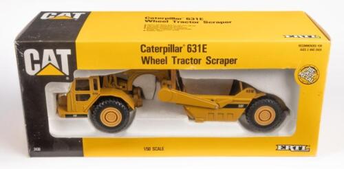 CATERPILLAR TRACTOR: A 1:50 scale Caterpillar 631E wheel tractor scraper model, finished in yellow CAT livery