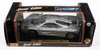 McLAREN: A 1:18 scale 1993 McLaren F1, silver colour, by Maisto Models, loose in box