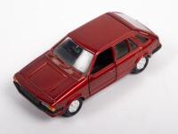FORD: A 1:40 scale Ford Laser GL hatch, colour red, by Yonezawa Toys, no box