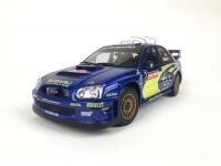 SUBARU: Three 1:18 scale Subaru Impreza rally cars produced by AutoArt (NB description) - 3