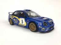 SUBARU: Three 1:18 scale Subaru Impreza rally cars produced by AutoArt (NB description) - 18