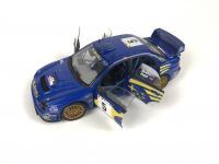 SUBARU: Three 1:18 scale Subaru Impreza rally cars produced by AutoArt (NB description) - 22
