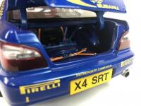 SUBARU: Three 1:18 scale Subaru Impreza rally cars produced by AutoArt (NB description) - 25
