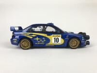SUBARU: Three 1:18 scale Subaru Impreza rally cars produced by AutoArt (NB description) - 30