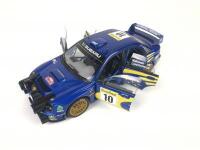 SUBARU: Three 1:18 scale Subaru Impreza rally cars produced by AutoArt (NB description) - 33