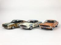 CHRYSLER: Three 1:18 scale Chrysler Valiant Charger racing cars produced by Classic Cars (NB description)