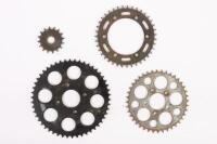 MOTORCYCLE SPROCKETS: A selection of four motorcycle sprockets, all the teeth seem to be in good condition&nbsp;[Location: Melbourne]