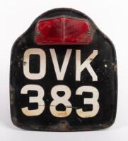 NUMBER PLATE: A British motorcycle number plate 'OVK383' with Britax&nbsp;stop light attached [Location: Melbourne]