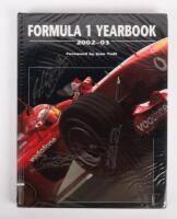 FORMULA 1: 'Formula 1 Yearbook 2002-03', hardcover book, cover signed by Michael Schumacher, Kimi&nbsp;Raikkonen and Jacques Villeneuve, 221 pages