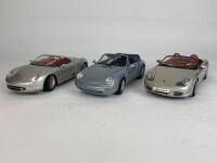 PORSCHE: Three 1:18 scale Porsche model cars (NB description)