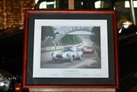 KEITH WOODCOCK: Limited Edition (216/475) framed and glazed print titled &lsquo;E-type at Terte Rouge 1962&rsquo; signed by co-drivers Briggs Cunningham and Roy Salvadori, plus the artist 64cm x 55cm [Location: Sydney] - 3